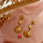 Boucle d'oreille pendante avec l'esprit de l'été et de la mer avec breloques coquillages