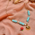 Collier joliment travaillé avec pendentif coquillage en acier inoxydable, perles de coquillage et perles d'eau douce