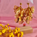 Boucle d'oreille pendante en acier inoxydable composée de 5 feuilles texturées et ajourées