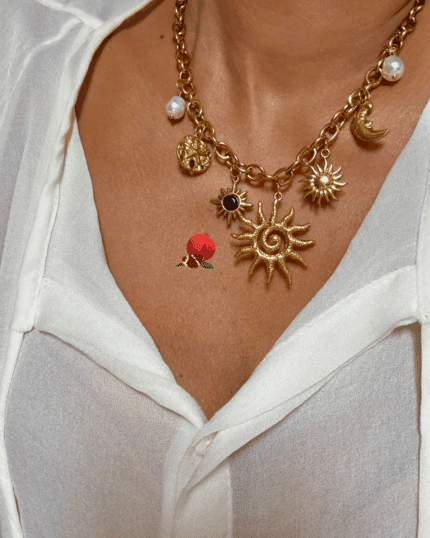 Collier composé de 7 breloques en acier inoxydable avec breloques : perles nacrées, soleil, lune, astres, ...
