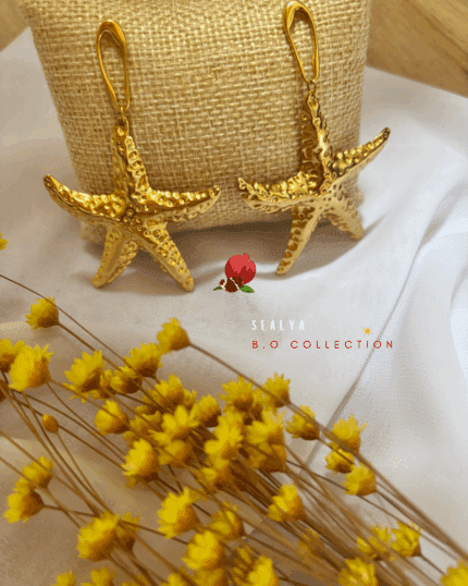 Boucle d'oreille pendante composée d'une étoile de mer XXL au design texturé en acier inoxydable